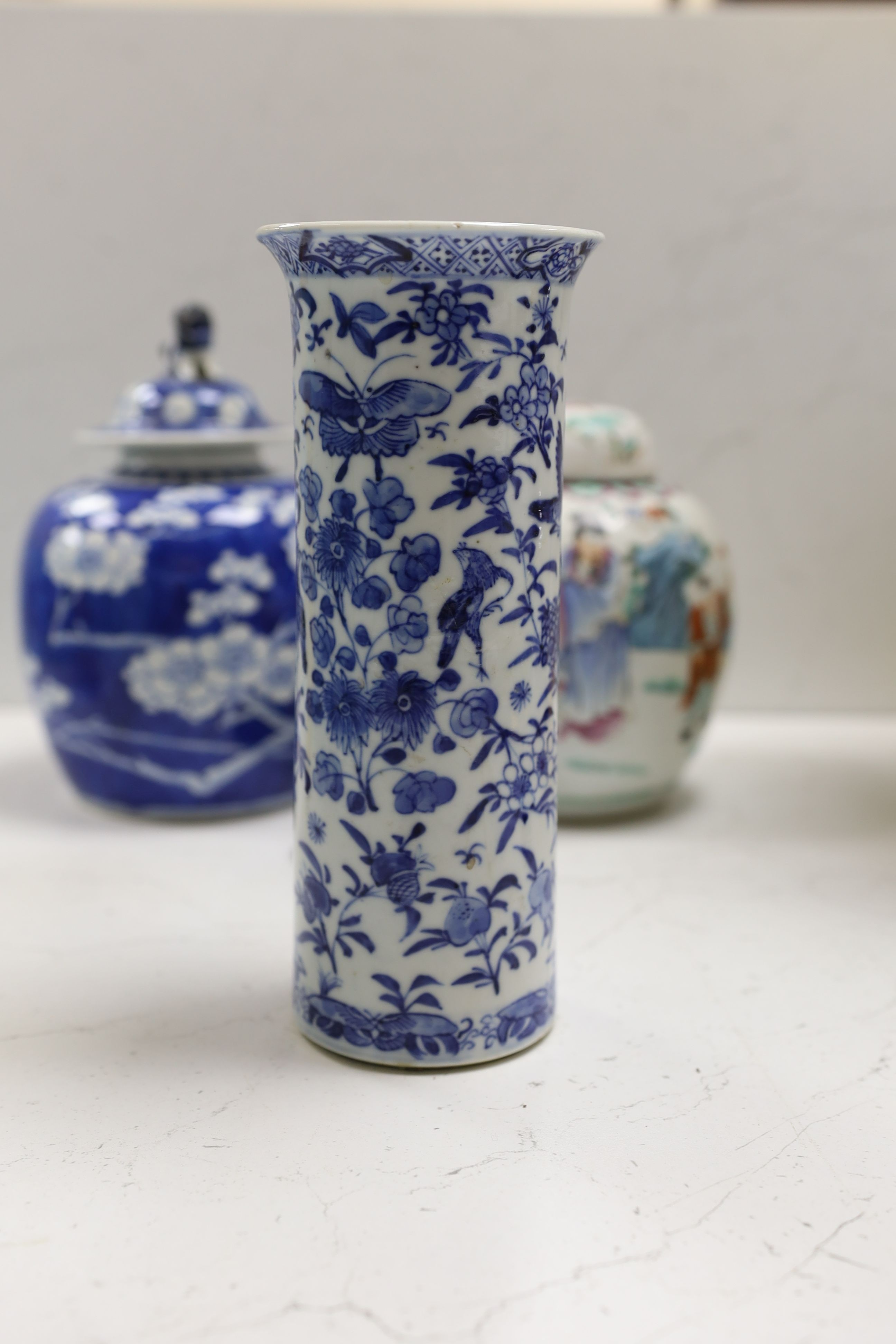 A Chinese famille rose ginger jar, a 19th century Chinese blue and white porcelain jar and cover, a blue and white cylinder vase, a small Chinese dish and orange glass vase (5)